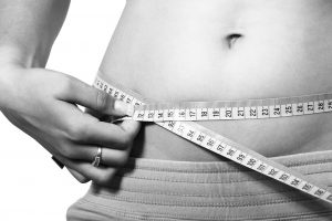 Woman measuring waist Weight Loss Tips - Your Wellness Centre Naturopathy Melbourne